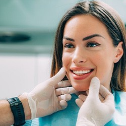 Lady smiles at dentist