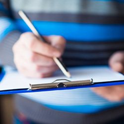 Patient filling out a dental insurance form