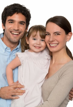 man and woman holding young daughter