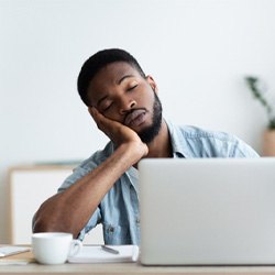 Man falling asleep at desk