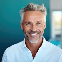 Portrait of confident middle-aged man with nice teeth