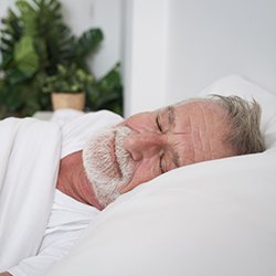 Man sleeping in bed