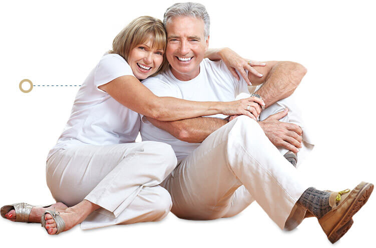 husband and wife hugging while sitting on floor