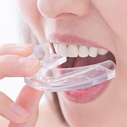 a person wearing nightguards to protect dental implants
