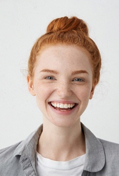 young woman smiling after getting Invisalign in Newburyport