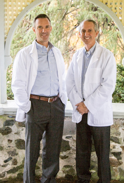 Dr. St. Clair and Dr. Beliveau outside the office 