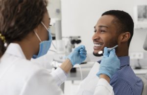 young man talking to his dentist 