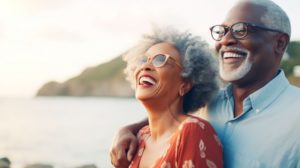 an older couple smiling with healthy teeth