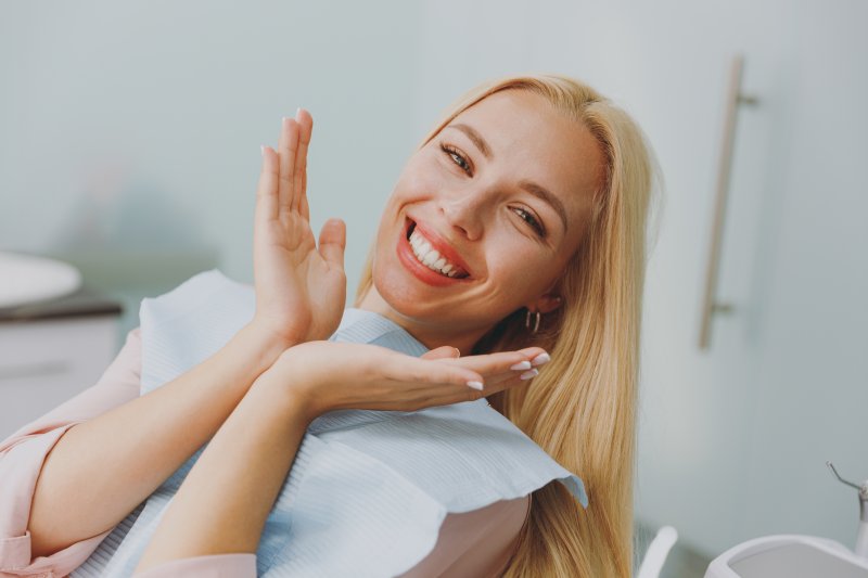 a patient smiling and showing off her brighter teeth